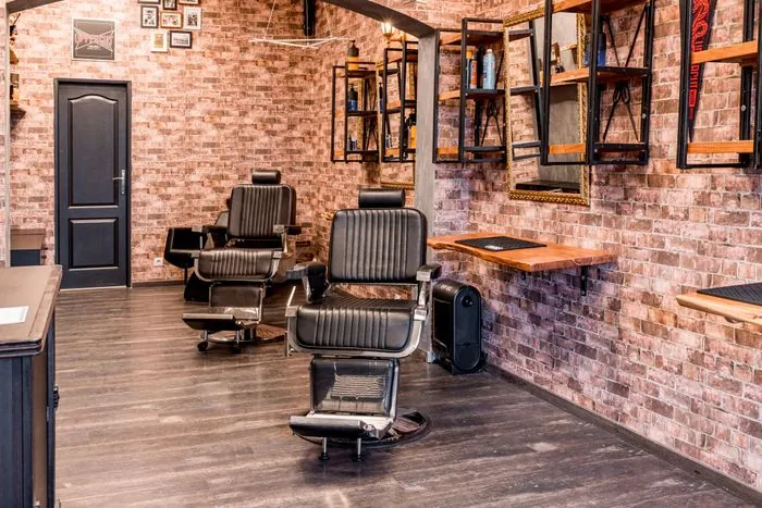 A brick-walled barber shop with three chairs